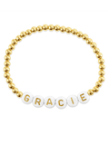 Image of: Name bracelet with gold beads on white background