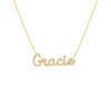 A gold-colored necklace with the name 'Gracie' inscribed on a chain.