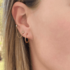 Double piercing earring with yellow gold and diamond paired with thin gold small hoop