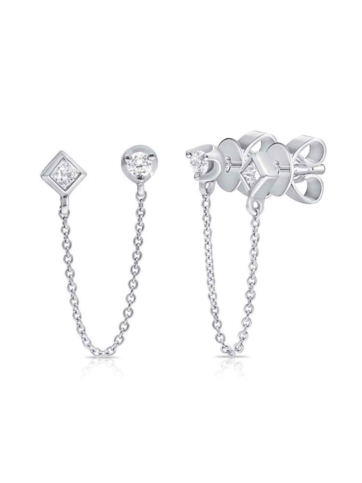 Double piercing earrings white gold and diamond stud on white background