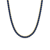Necklace with blue cz stones and gold accents on a white background