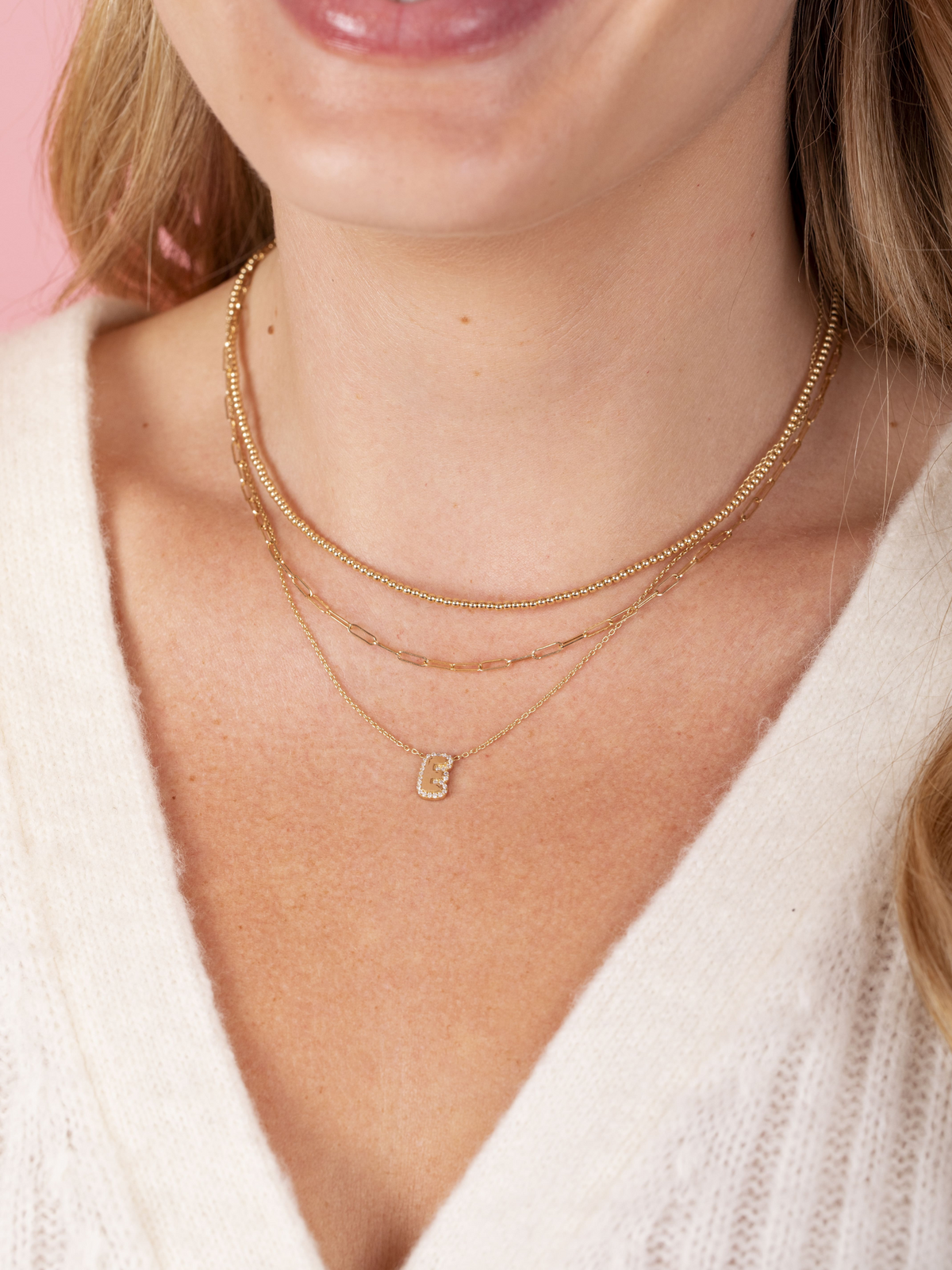 gold bubble letter E necklace with diamonds