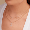 14K gold large diamond initial charm on dainty gold paperclip necklace layered with diamond layering necklace and gold charm initial necklace