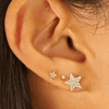 Larger diamond star stud paired with diamond stud and mini star stud on model ear
