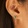 Emerald and diamond chain stud paired with diamond v earrings on model ear