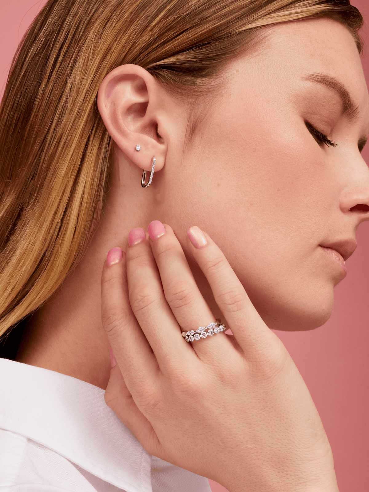 Oval diamond stud earrings white gold paired with paperclip diamond huggie