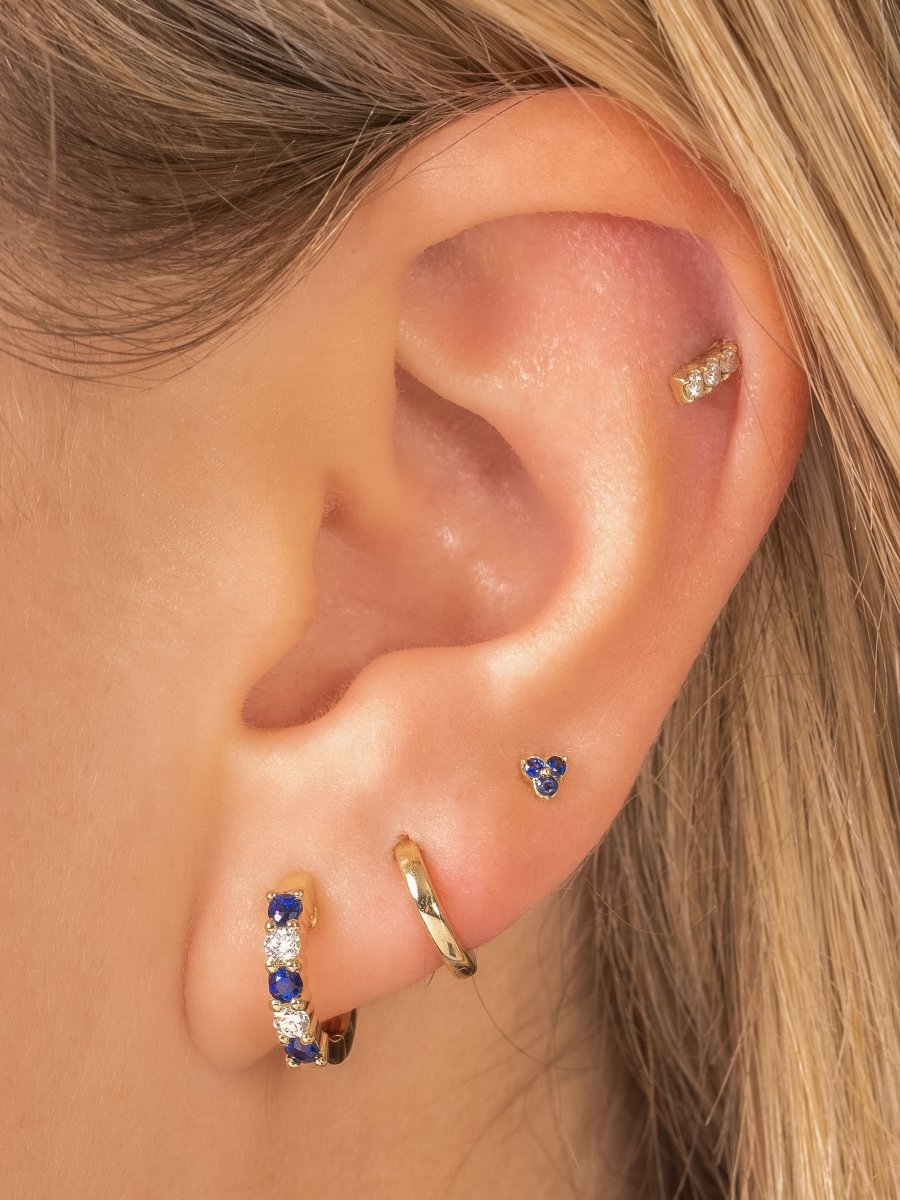 Sapphire and diamond huggie paired with gold huggie, small trio sapphire stud and diamond bar stud