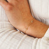 Dainty gold chain bracelet with two diamond initial charms