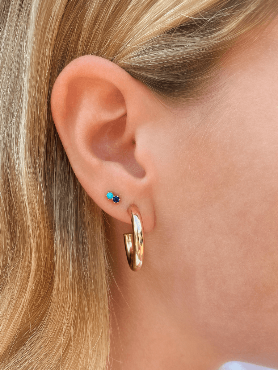 Turquoise stud earrings with sapphire paired with chunky gold hoops