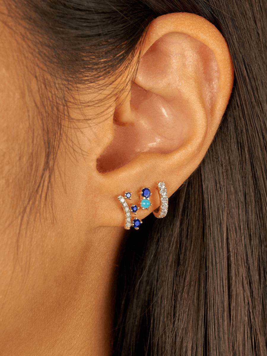 Sapphire stud earrings with turquoise paired with diamond huggie and crown blue sapphire stud