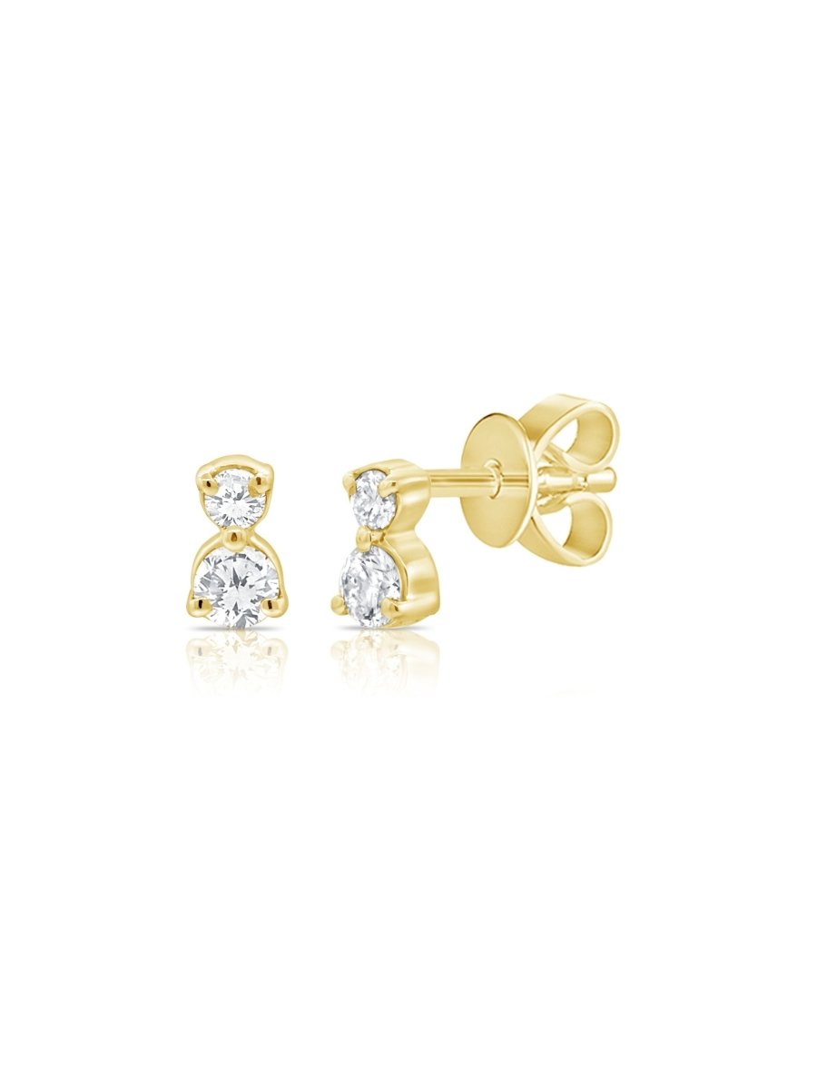 Tiny diamond stud earrings yellow gold on white background