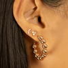 Bridge diamond earring paired with diamond trio stud and gold bead hoops