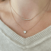 Diamond bar necklace yellow gold layered with single diamond heart necklace