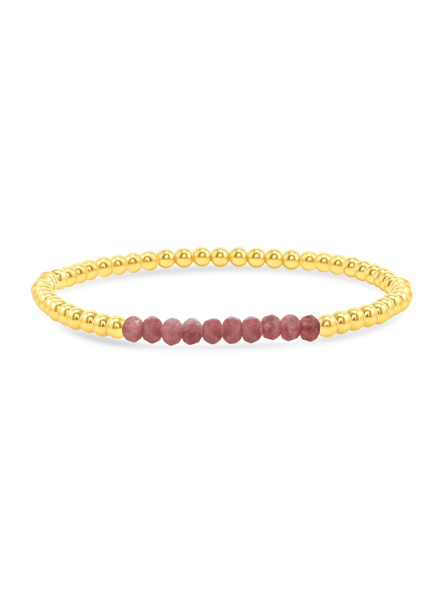 Pink tourmaline and gold fill beaded bracelet on white background