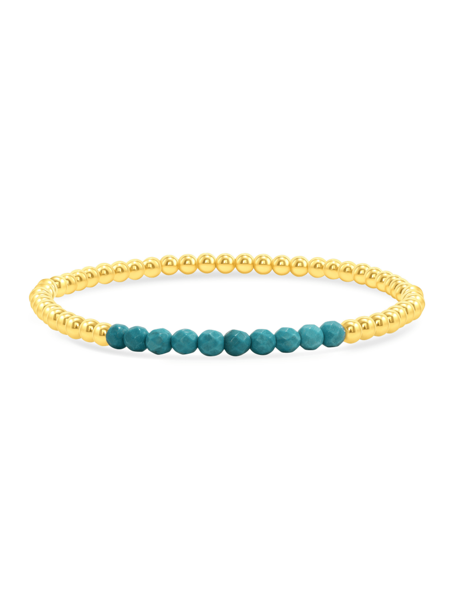 Turquoise and gold fill beaded bracelet on white background