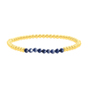 Blue sapphire and gold fill beaded bracelet on white background