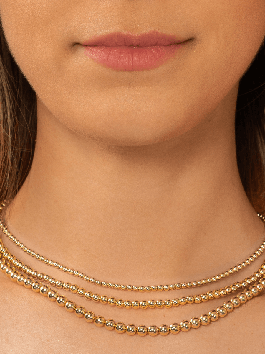 Gold beaded choker necklaces in different sizes