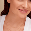 Dainty gold chain necklace layered with diamond baguette bar necklace and gold initial necklace with diamond baguette