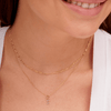 Dainty gold chain necklace layered with diamond initial necklace