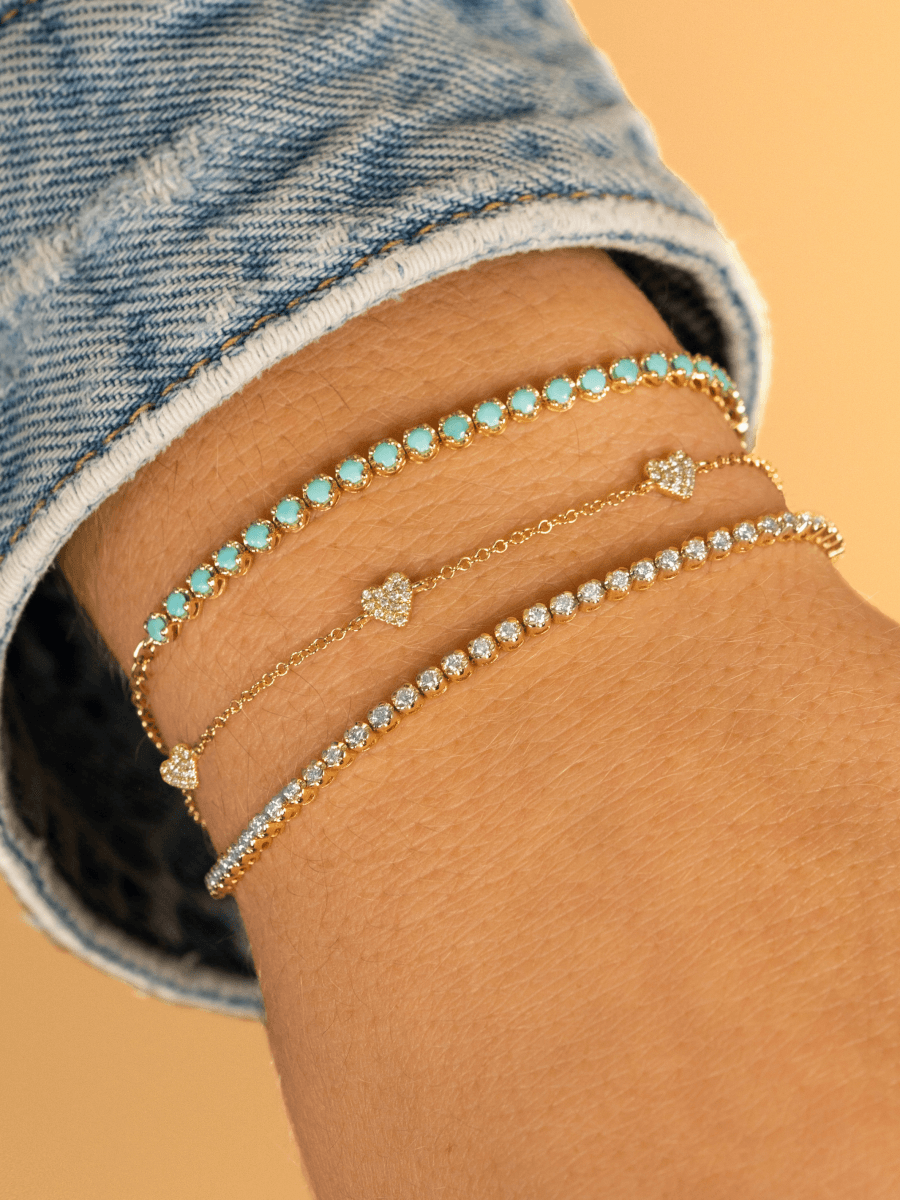 Bezeled diamond tennis chain bracelet stacked with bracelet with diamond hearts on  dainty gold chain and turquoise tennis chain bracelet