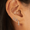 Ear stack with two diamond initial studs and diamond huggie