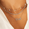 14K diamond name charm on dainty chain layered with diamond tennis chain necklace and diamond heart layering necklace in gold