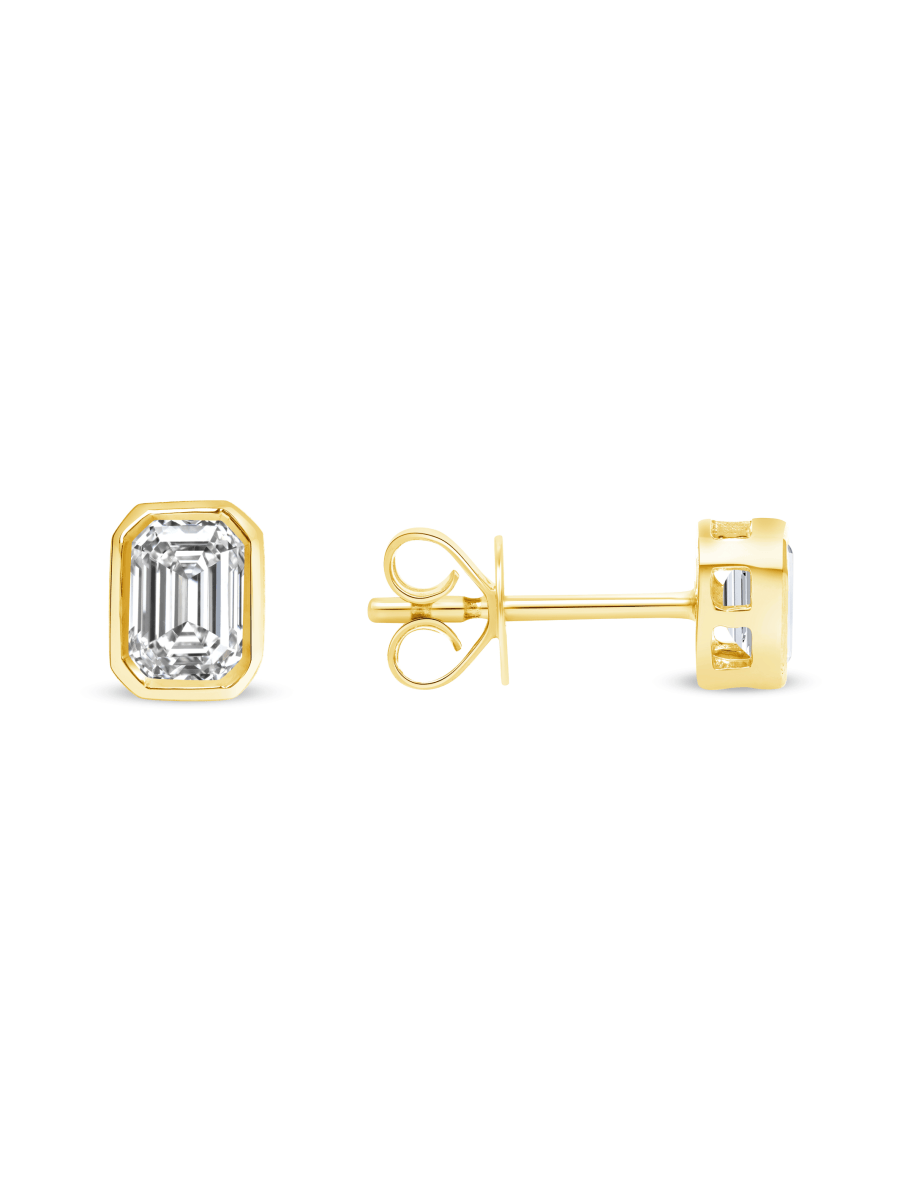 Emerald cut diamond stud earrings yellow gold on white background