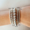Silver stretchy beaded bracelets on model wrist
