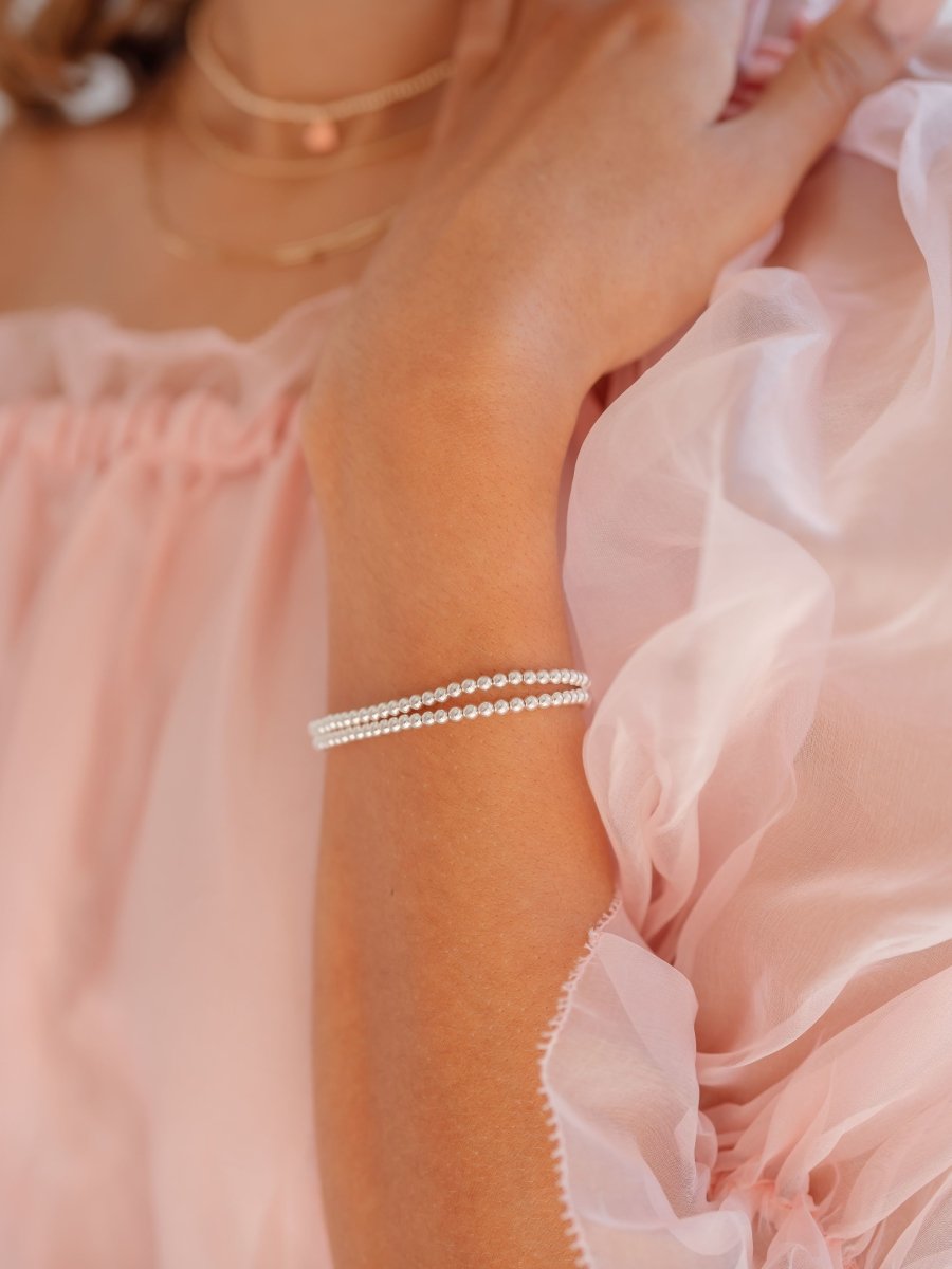 Gold layered stretch bracelet with white and pink beads - La Maison