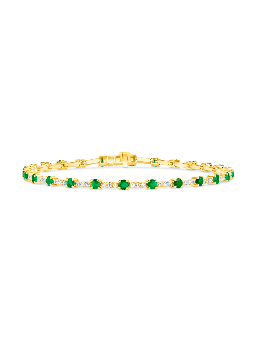 14K yellow gold emerald and diamond tennis bracelet on white background