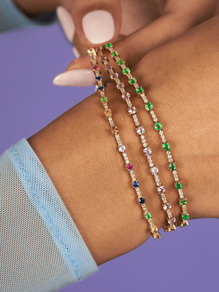 Emerald and diamond tennis bracelet, pink sapphire and diamond tennis bracelet, and rainbow tennis bracelet with diamonds