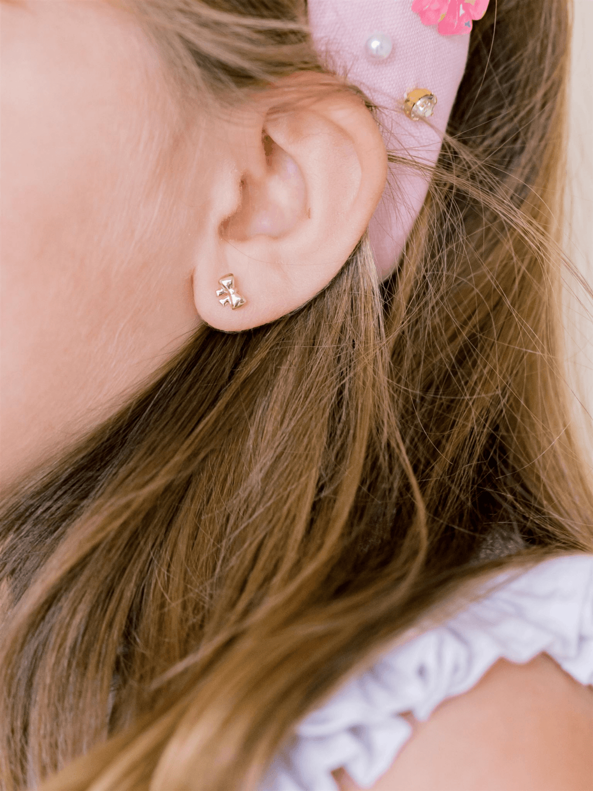 Gold bow stud earrings