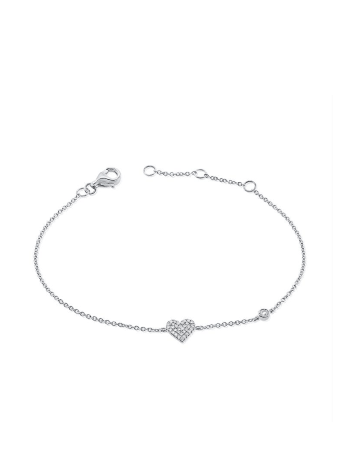 white gold diamond pave heart stationed bracelet with a bezel diamond on white background