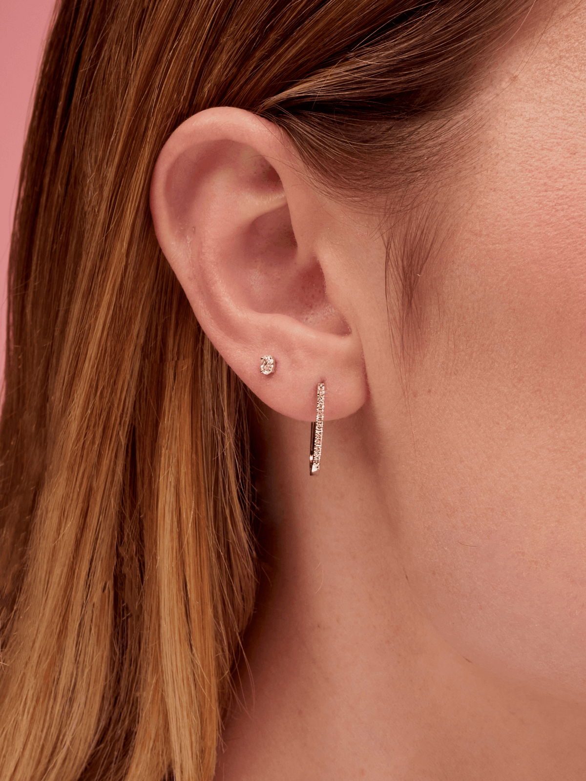 Diamond Paperclip Earring in White Gold on Ear in First Hole of Ear and Small Oval Diamond Stud in Second Hole