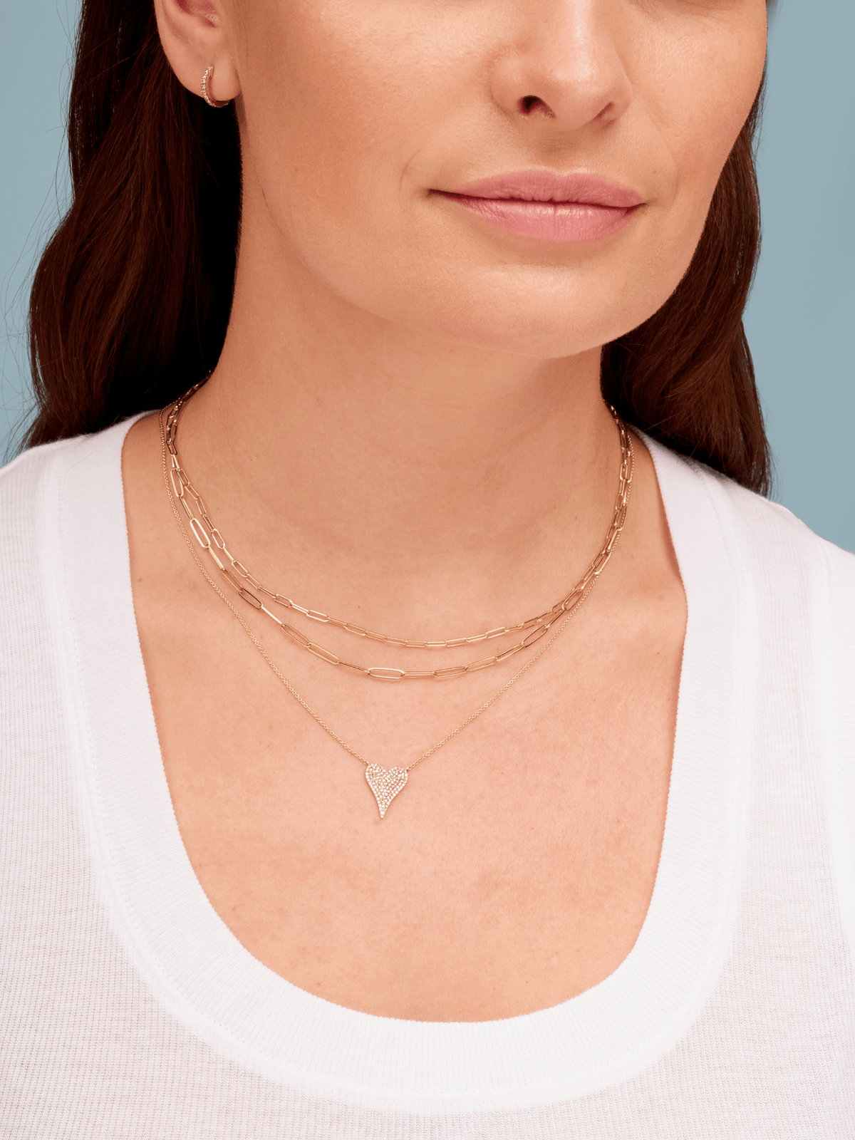 14K gold paperclip chain necklaces layered with diamond heart necklace