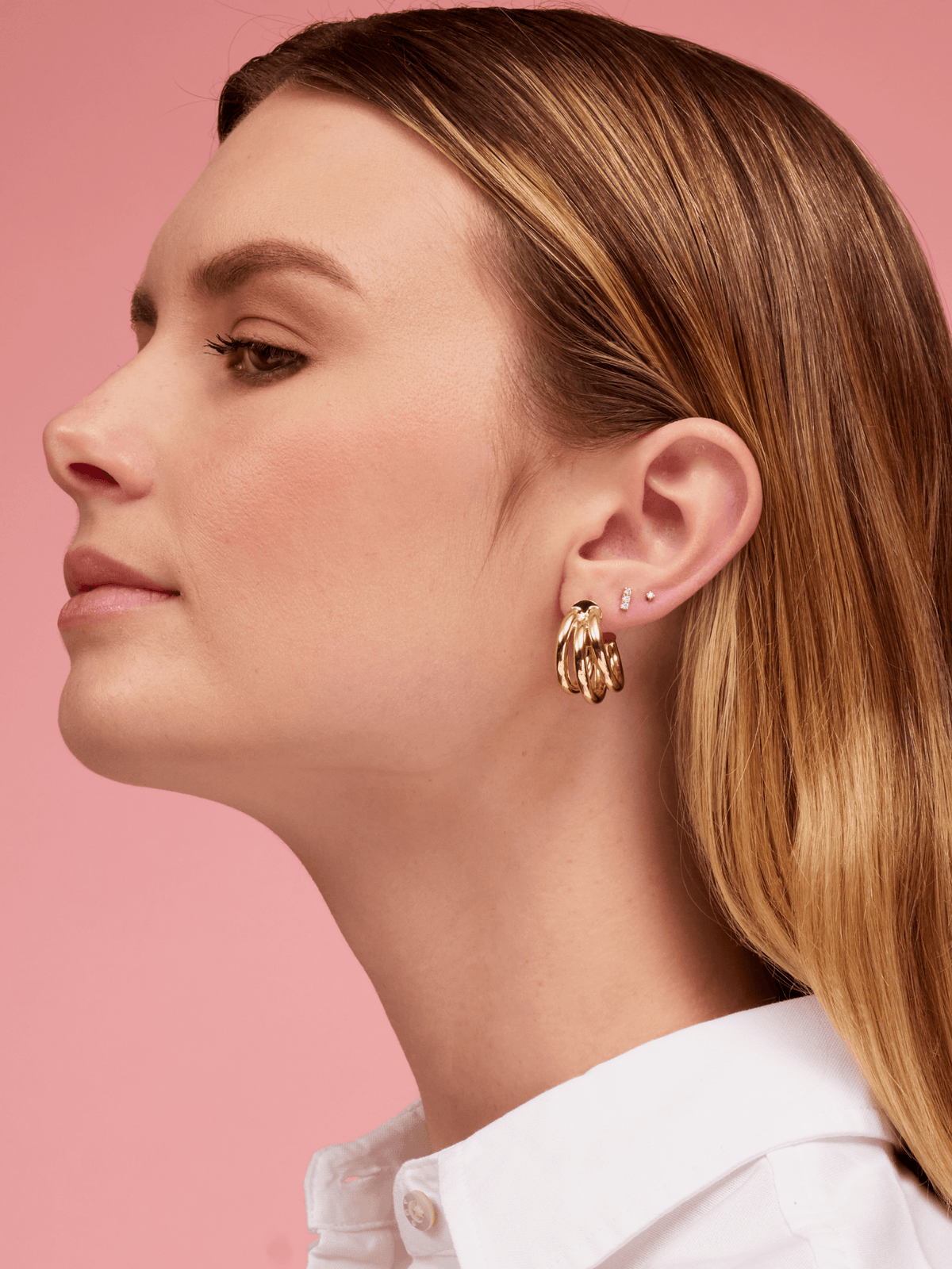 Tiny diamond earring paired with diamond bar stud and chunk gold earrings