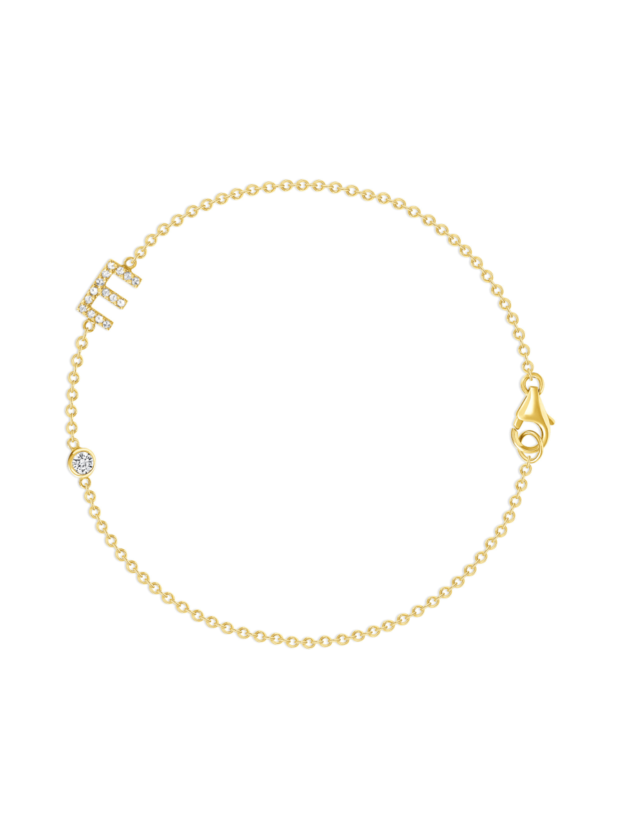 Dainty gold chain bracelet with diamond initial charm and small round diamond