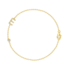Dainty gold chain bracelet with diamond initial charm and small round diamond