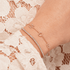 Dainty gold chain bracelet with two pave diamond initials and gold heart layered with diamond tennis bracelet