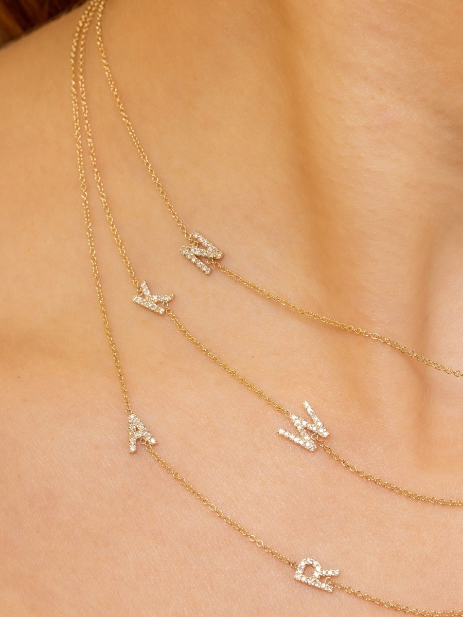 Diamond initial charms on gold chains