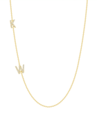 Two dainty diamond initial charms on simple gold chain on white background