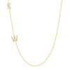 Two dainty diamond initial charms on simple gold chain on white background