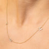 Dainty yellow gold chain with three diamond initials