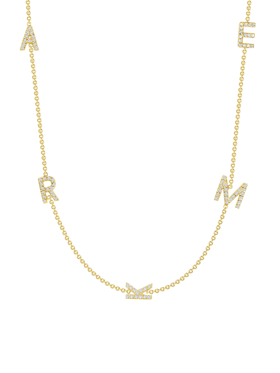 Five dainty diamond initial charms on simple gold chain on white background