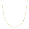 yellow gold single initial chain necklace with baguette diamond on white background