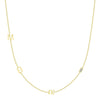 yellow gold triple initial chain necklace with baguette diamond on white background