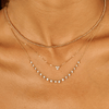 3 diamond drop necklace layered with gold beaded choker and graduated diamond layering necklace