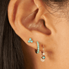 Cluster turquoise earring paired with turquoise huggie and turquoise and diamond dangle huggie