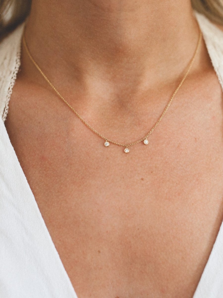 Gold diamond bezel necklace in yellow gold 