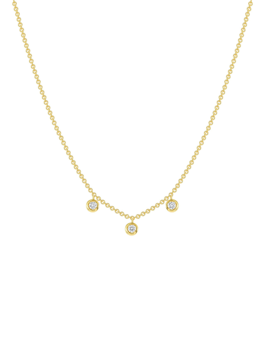 Gold diamond bezel necklace in yellow gold on a white background